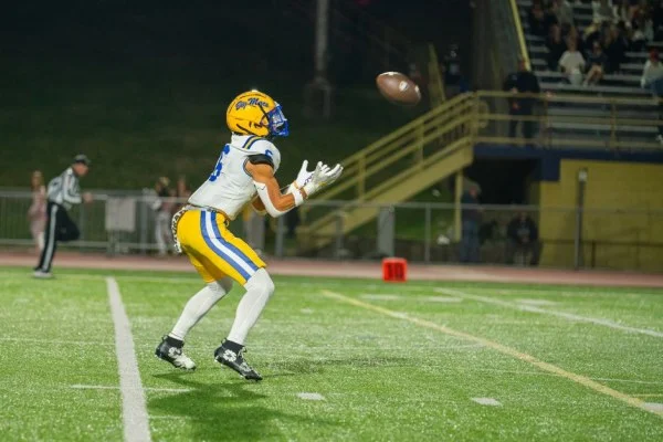 American football wide receiver catching